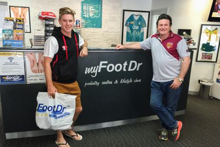 Adam Zampa from West End Redbacks with Greg Dower at my FootDr